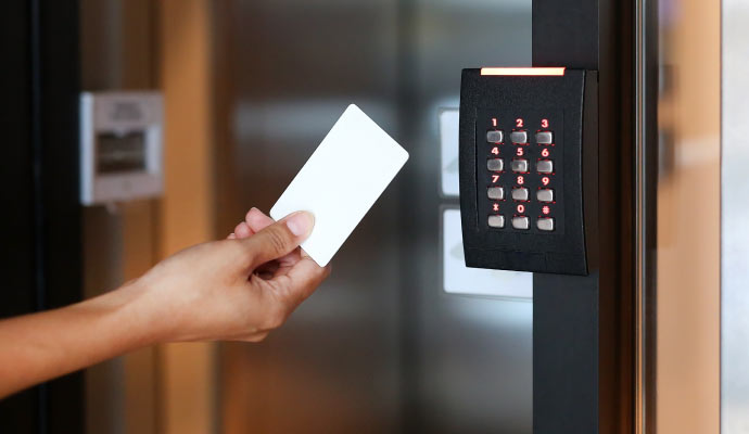 A keypad access control system is mounted on a wall