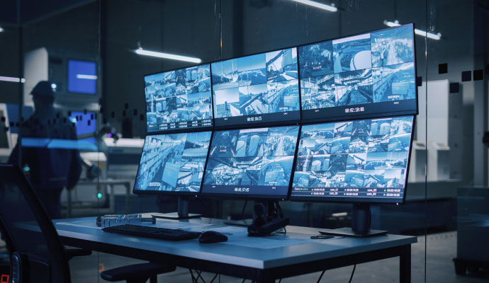 Monitors displaying surveillance footage in a security control room