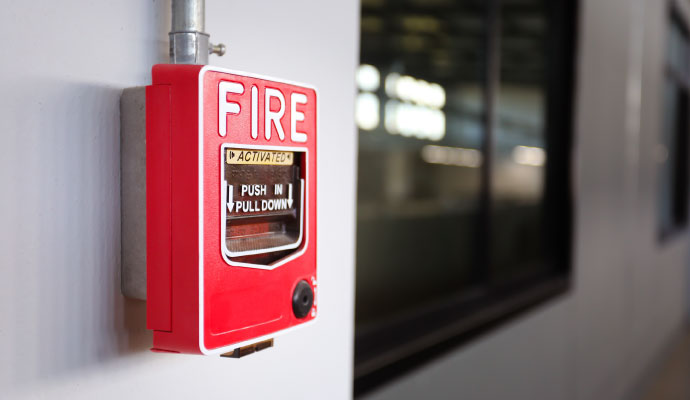 Activated red fire alarm pull station