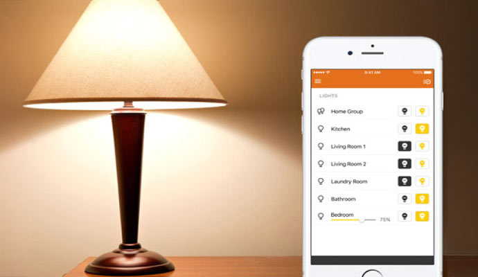 A smartphone with an app is controlling a table lamp