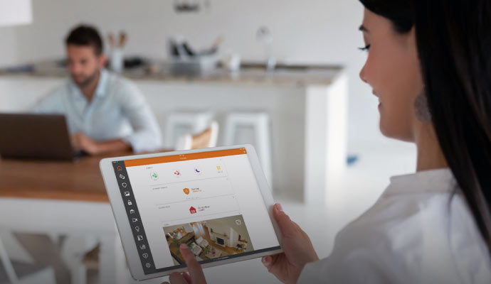 a woman accessing home automation system from office