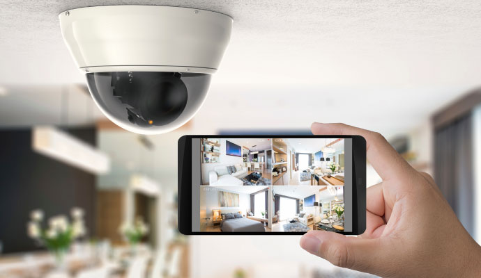 Smartphone showing home security camera views.