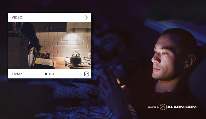 person monitoring home using a smartphone